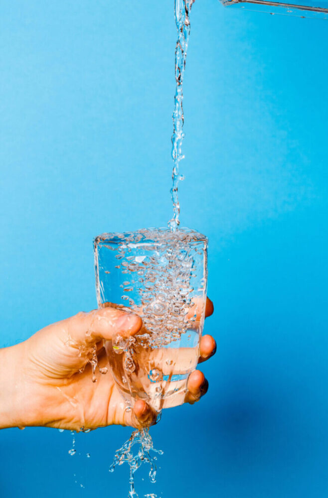 Image of hand holding glass